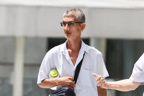 Bus driver sat with placard hung around his neck on Jurong grass patch to share religious message, fined $1k