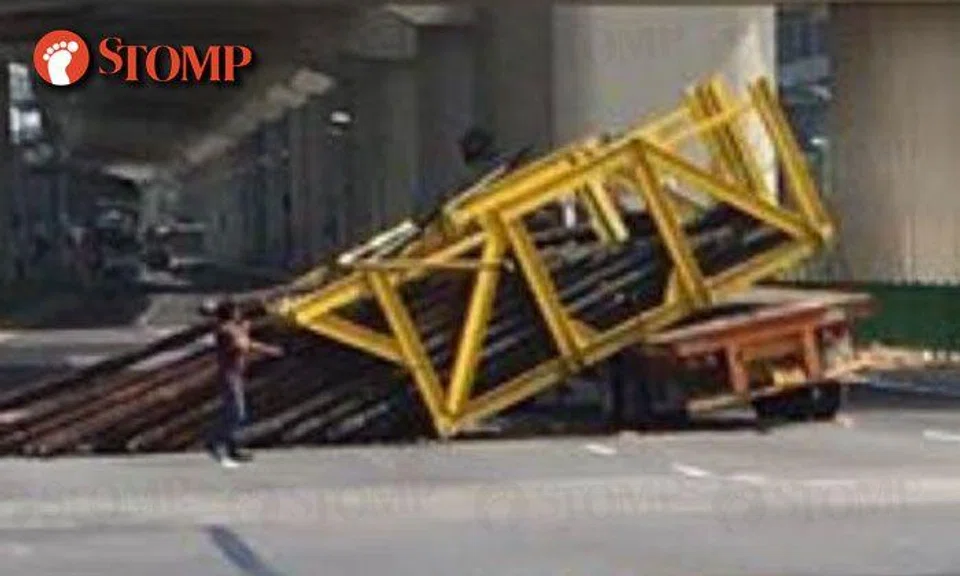Heavy load falls off truck after driver allegedly failed to slow down while turning at Pioneer Rd