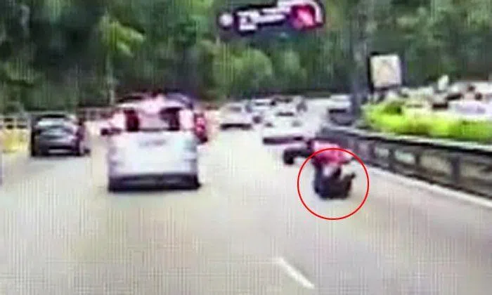 Scooter rider skids and crashes -- thanks to driver's reckless lane ...
