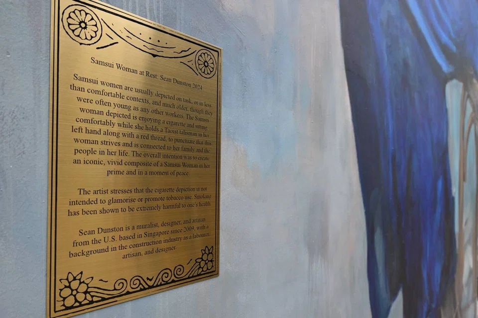 The text of the newly installed plaque on the controversial samsui woman mural on 297 South Bridge Road.