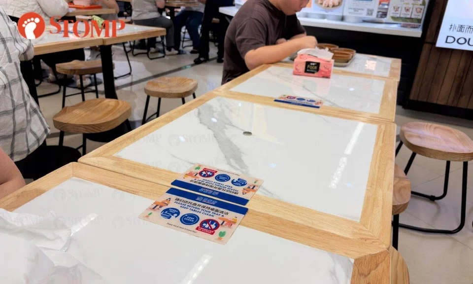 Someone used a 50-cent coin to "chope" a table at the Scarlett foodcourt 