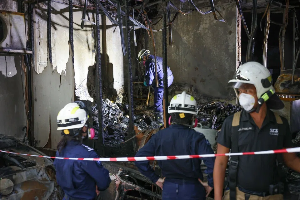 SCDF officers at the River Valley shophouse for investigations on April 9.