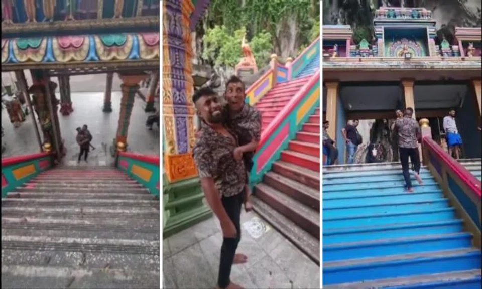 Man shows devotion by carrying brother with cerebral palsy up steps to Batu Caves for Thaipusam