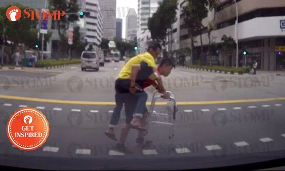 Most uplifting video you'll watch today: DHL driver piggybacks elderly man struggling to cross road