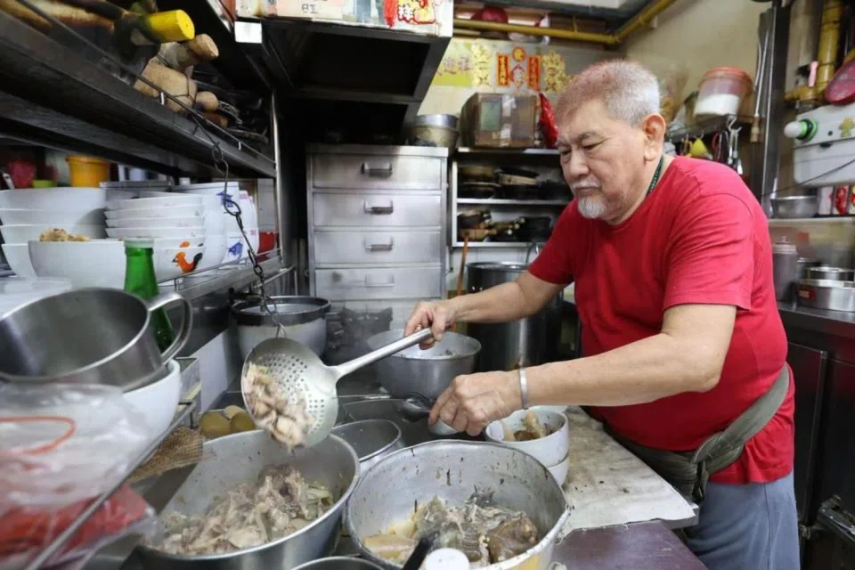Second-generation hawker, Mr Chua, operates the stall with the help of an assistant.