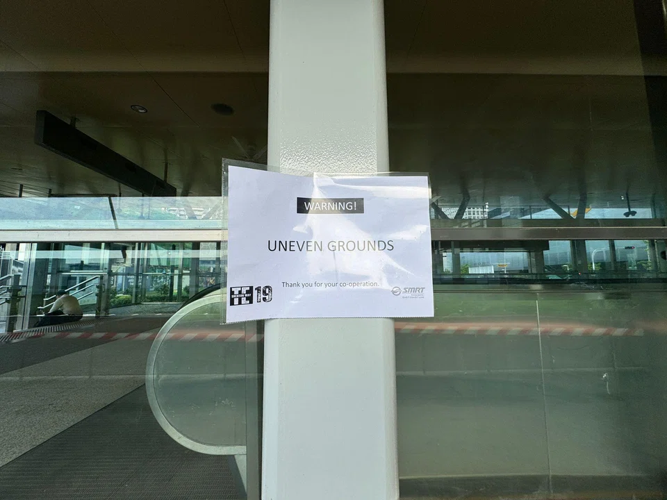 A note on a pillar near one entrance of the Shenton Way MRT Station reads: “Warning! Uneven grounds.”