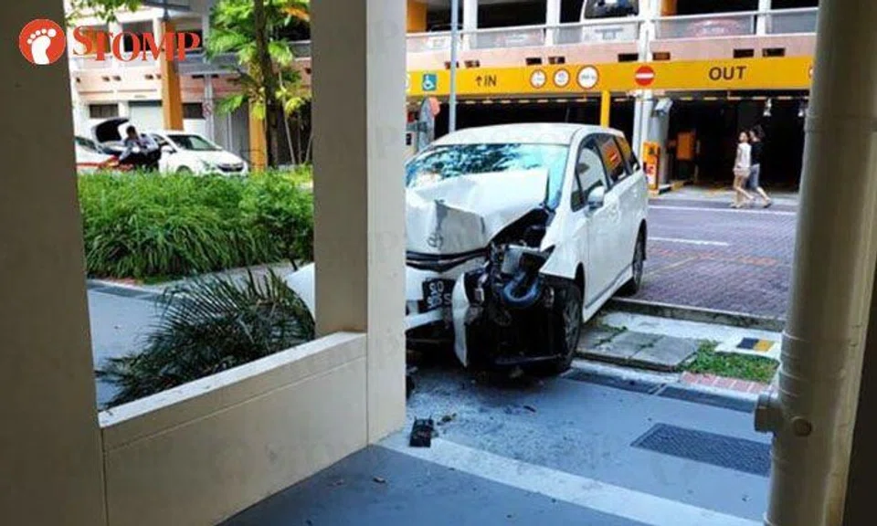 Driver taken to hospital after running parking barrier down and mounting kerb in Sengkang