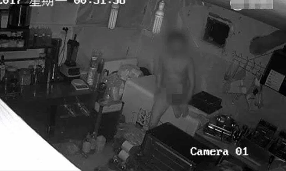 Nude thief caught on camera sneaking into China hamburger store to steal apron and $162