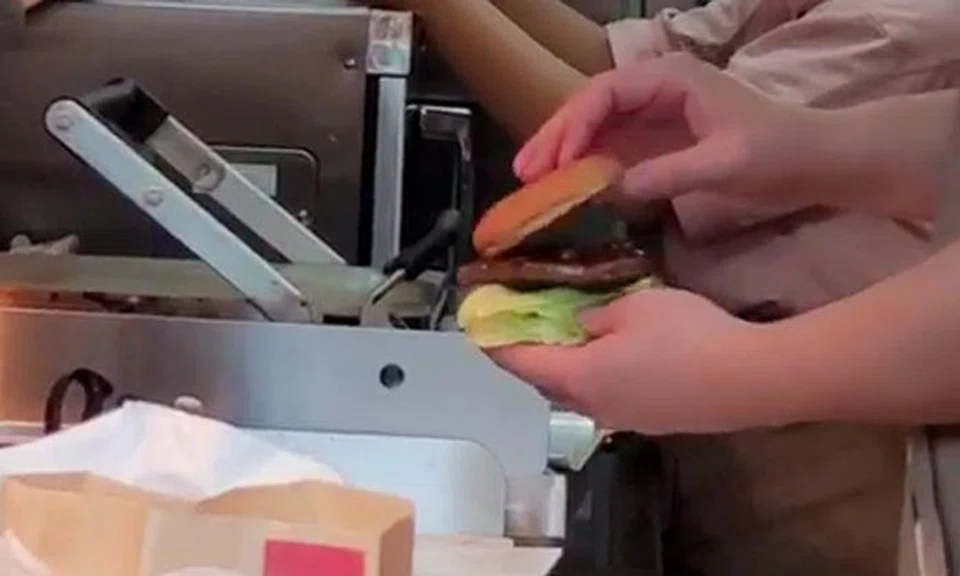 F&B staff must not handle any cooked food with bare hands, says SFA about Mos Burger video