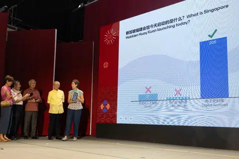 Digital Development and Information Minister Josephine Teo (right) at the launch of Singapore Hokkien Huay Kuan's digital database on Feb 15.