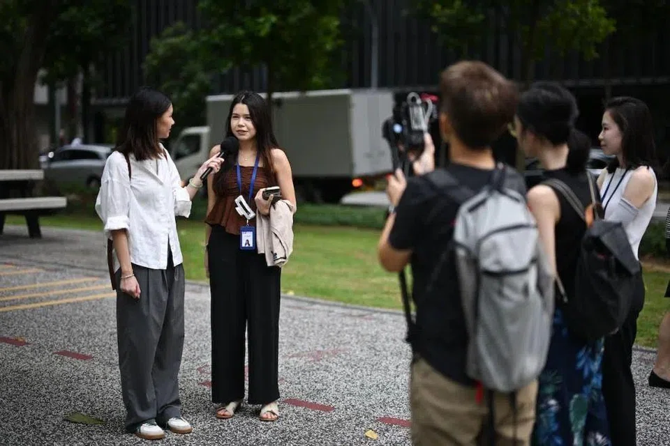 The writer interviewing Ms Jane Fernandez, 23, a market analyst, near Tanjong Pagar MRT station on Dec 17, 2024