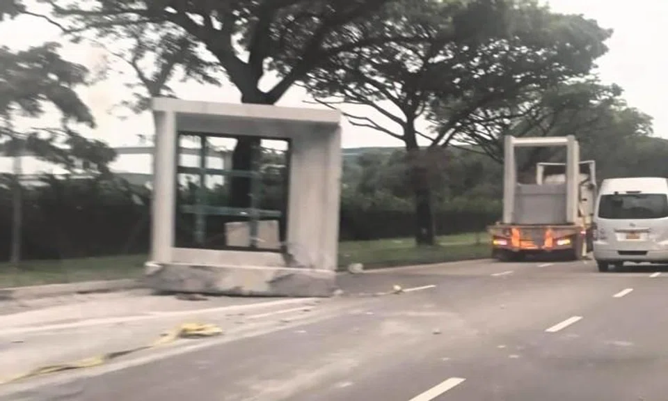 Huge concrete block falls off trailer in Tuas South, driver assisting with police investigations