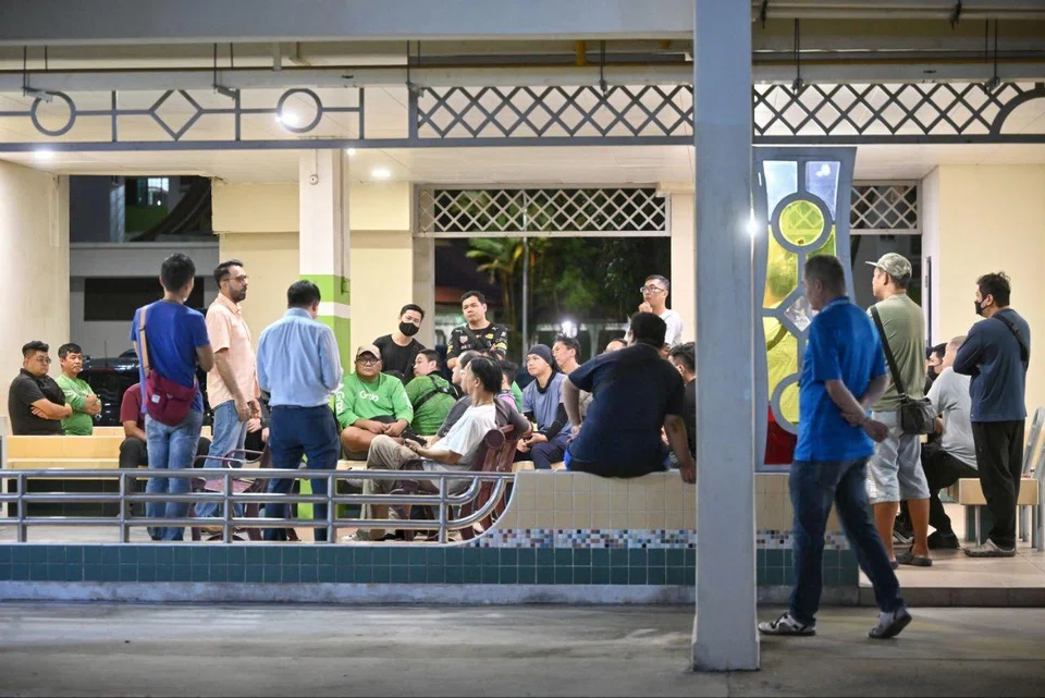 A group of about 30 delivery riders meeting with Leader of the Opposition Pritam Singh (in orange) at 615 Bedok Reservoir Road on July 7.
