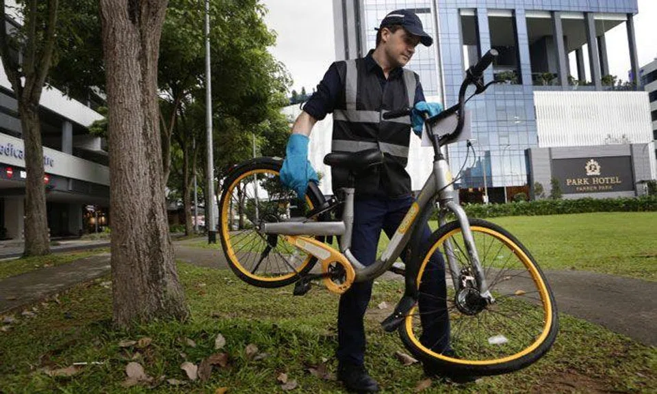 Mr Zhivko Girginov, with a bike found in the Farrer Park area yesterday. He focuses on damaged bikes which may pose a threat to the safety of users. ST PHOTO: KEVIN LIM