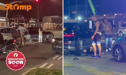 Motorcyclist lies under car after Alexandra Road accident, woman assisting with investigations