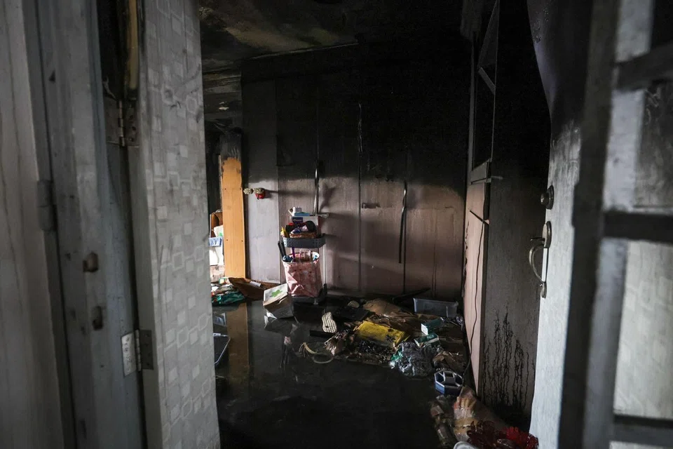 A view of the burnt flat as seen from the front gate at Block 5, Holland Close on June 20.