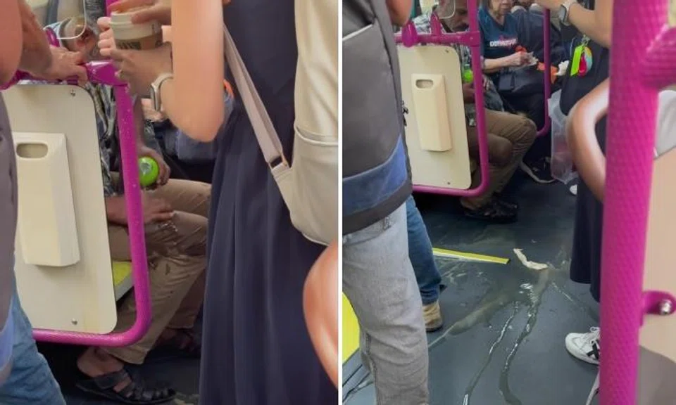 Woman's coffee spills on man's pants on bus, he pours water to clean it off