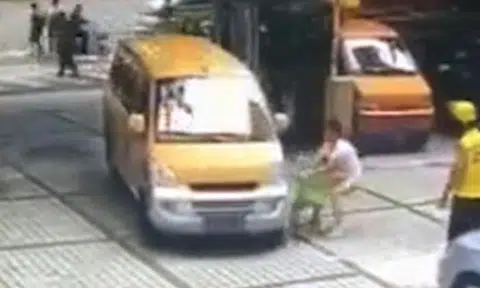 Guangzhou woman pushes son towards oncoming van, does something even more epic after failing
