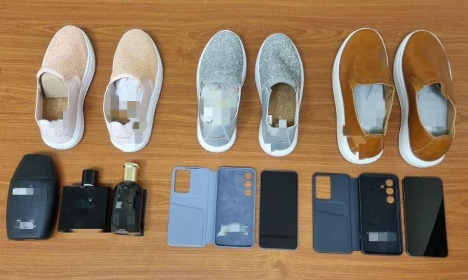 Two mobile phones, mobile phone accessories, some cosmetic and footwear, which are believed to have been purchased with the credit cards, were found in their possession and seized as case exhibits.