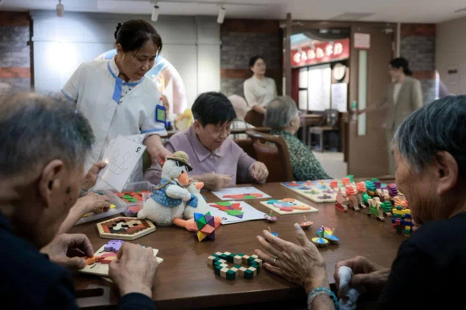 Residents engaging in activities at the Renshoutang Xijiao Xiehe Eldercare and Retirement Home in Shanghai on June 5.