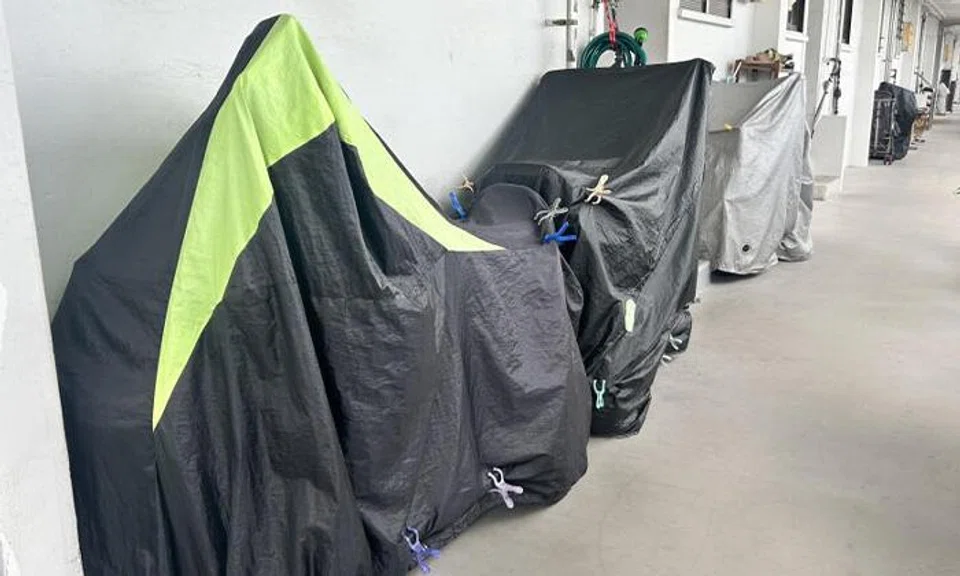 A family of three parked and charged their four personal mobility aids (PMA) in the shared corridor, though neighbours assumed they did not have any disabilities.