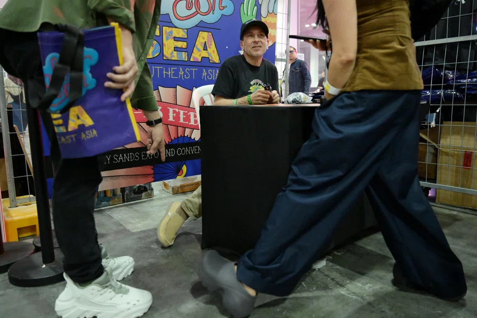 Designer Steven Smith showing fans at Sneaker Con 2025 his Crocs on Feb 22.