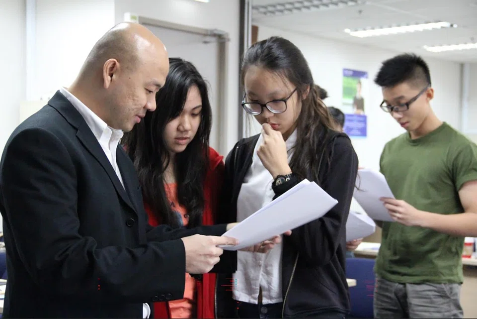 Mr Sean Chua, co-founder of Winners Education Centre, with his chemistry students.
