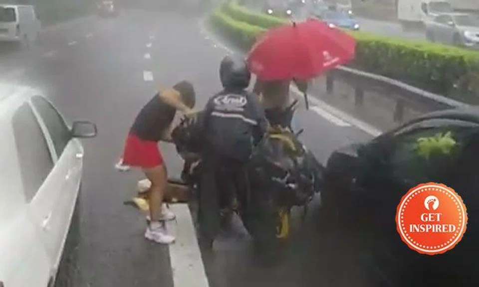 Road users rally to help rider who skidded and fell on expressway during heavy downpour