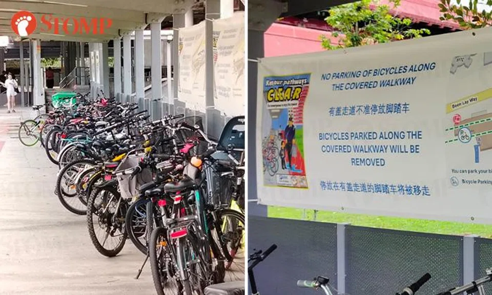 Bicycles are being parked right in front of anti-parking signs near Lakeside MRT station.