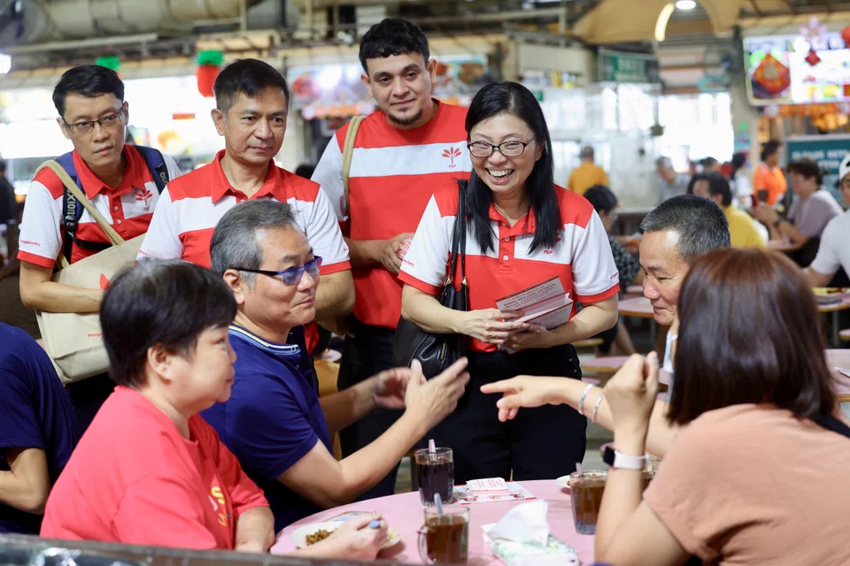 Ms Hazel Poa (right) and (second from left) Mr Sumarleki Amjah speaking with residents during a PSP walkabout on April 5.