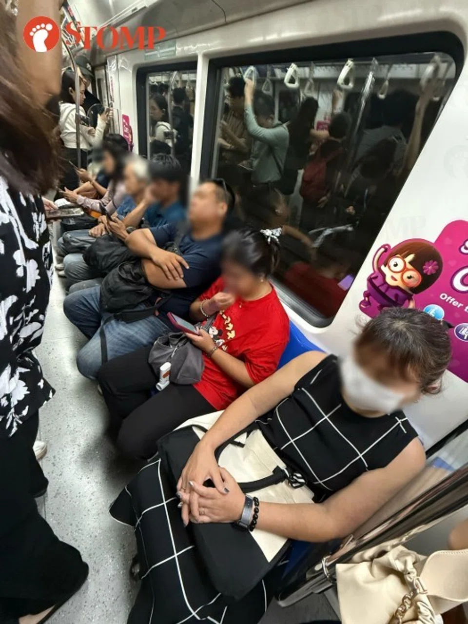 Pregnant woman standing on train
