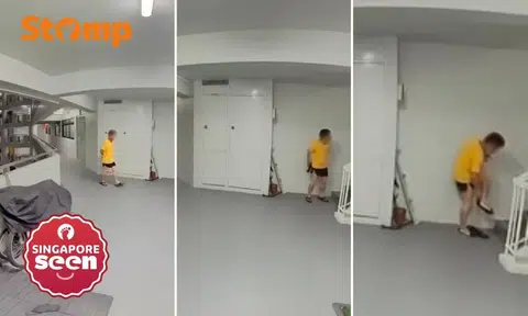 Man caught on camera 'weirdly' putting on women's shoes outside Stomper's Tampines flat at 1.05am