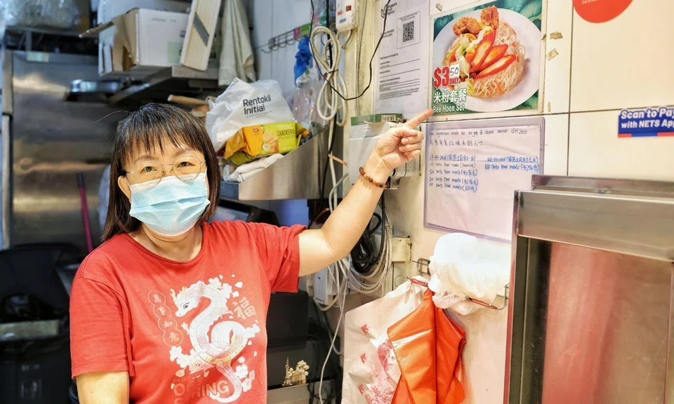 elderly couple charged at Bukit Batok stall that offered free meal scheme. 