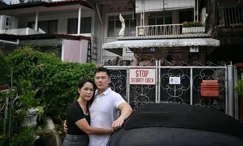 The victim, Mr Elgar Kwek, and his partner, Ms Brenda Chow, at the landed property in Katong that Mr Kwek owns.