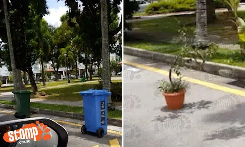 We've bin doing it wrong: Westwood Crescent private residents 'chope' their parking lot with trash cans and flower pots