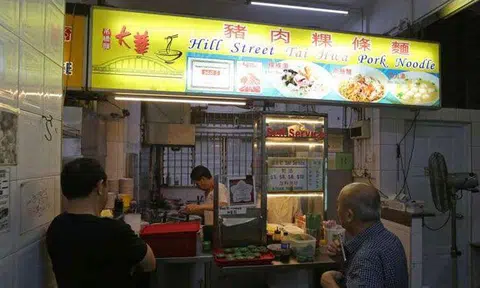 Hawker stalls selling bak chor mee and chicken rice awarded with Michelin stars