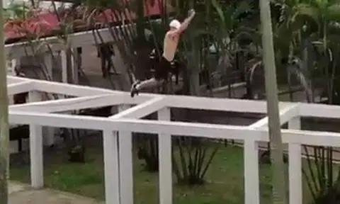 Guy does 'standing broad jump'... on roof of HDB walkway structure