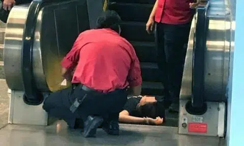 Woman faints after falling down escalator at Queenstown MRT Station, was not using phone