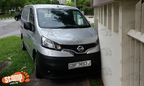 Van driver slams into wall outside condo after allegedly trying to avoid car at Tampines St 73