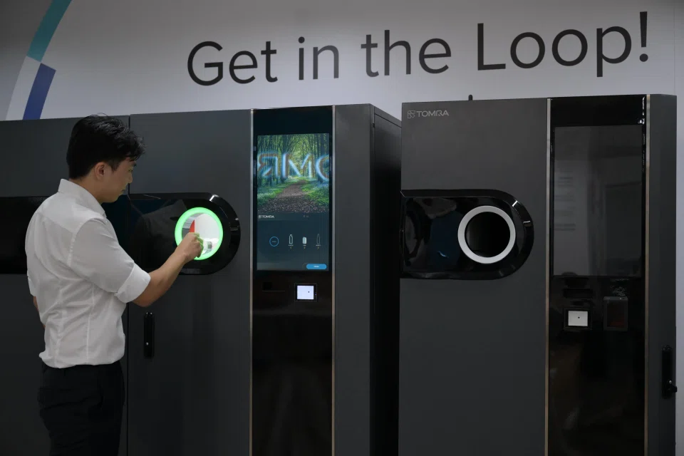 The two types of reverse vending machines revealed by TOMRA at its new office. PHOTO: The Straits Times
