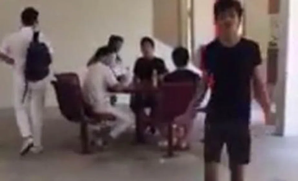 Students allegedly smoke and litter in uniform at void deck -- then get aggressive when told off