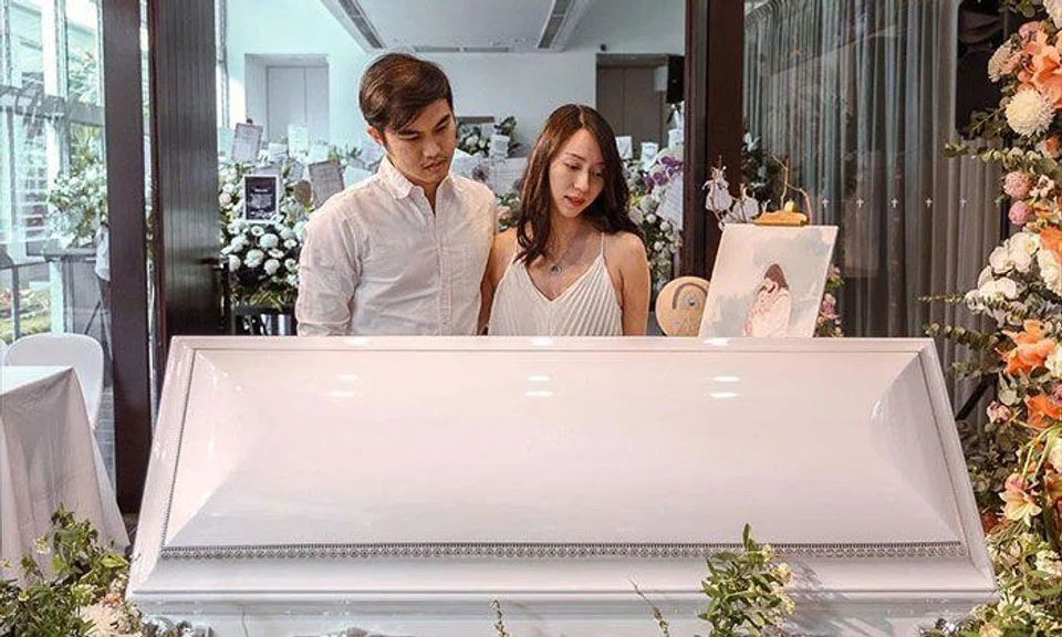 Influencer Melissa Koh and husband James Chen at the funeral of their son Asher, who died at 21 months in early April. PHOTO: MELISSACKOH/INSTAGRAM