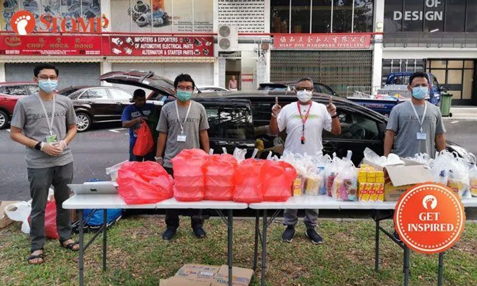 Volunteers give out necessities and clothes to Malaysian workers stranded by lockdown