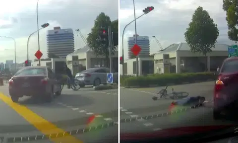 Man cycles against traffic flow along central road divider in Bugis, gets hit by car