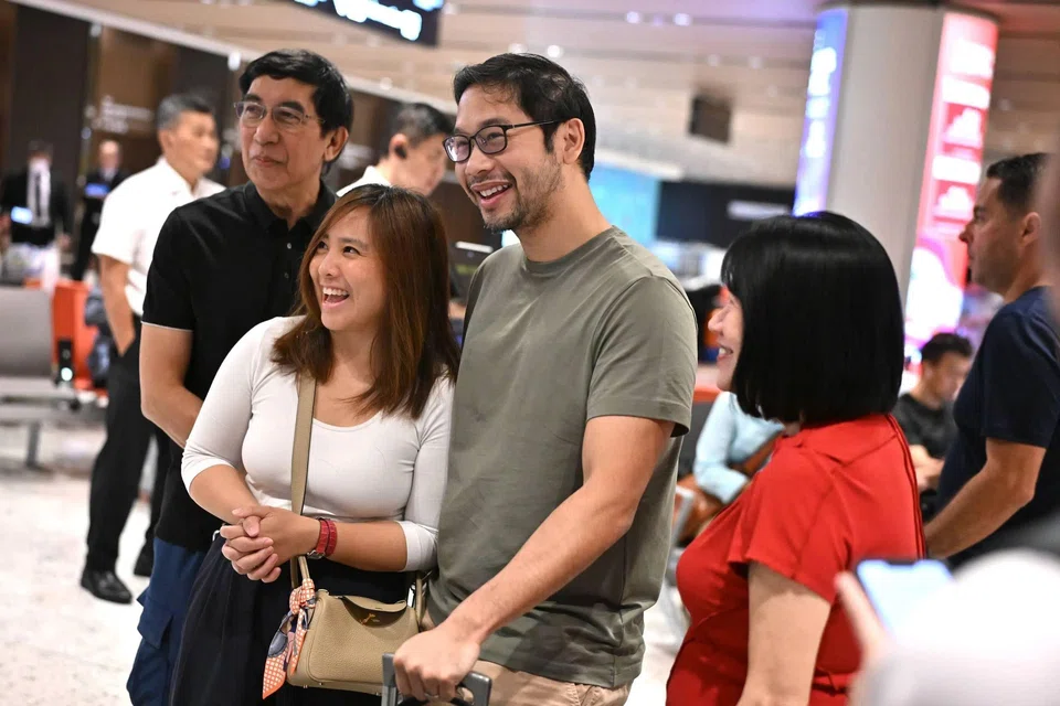 Mr Carl Rajoo, who returned from Dubai, was greeted by his wife Geraldine Lin at Changi Airport Terminal 1 on March 5. ST PHOTO: LIM YAOHUI