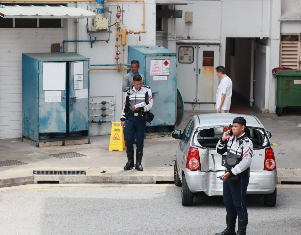 Police officers at the scene of the car accident in Bishan in 2023. Loh Chun Meng was sentenced to two weeks’ jail, fined $2,000 and banned from driving for two years.