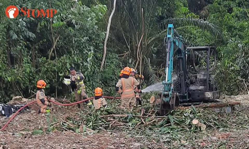 An excavator caught on fire in a grass field near Capricorn Drive on June 26. 