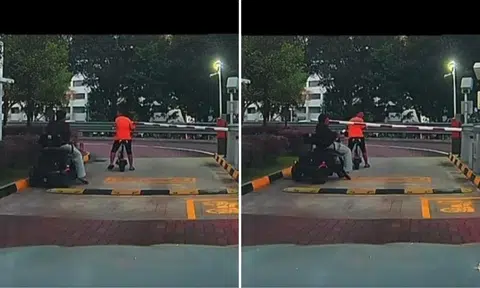 two men on pmd getting past carpark gantry