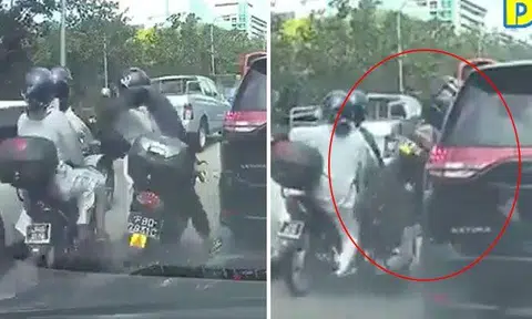 Motorcyclist with P-plate attempts to squeeze between vehicles, learns a painful lesson