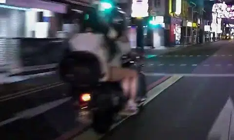 Guy has not 1 but 2 female pillion riders on motorcycle -- and 1 of them isn't even wearing a helmet